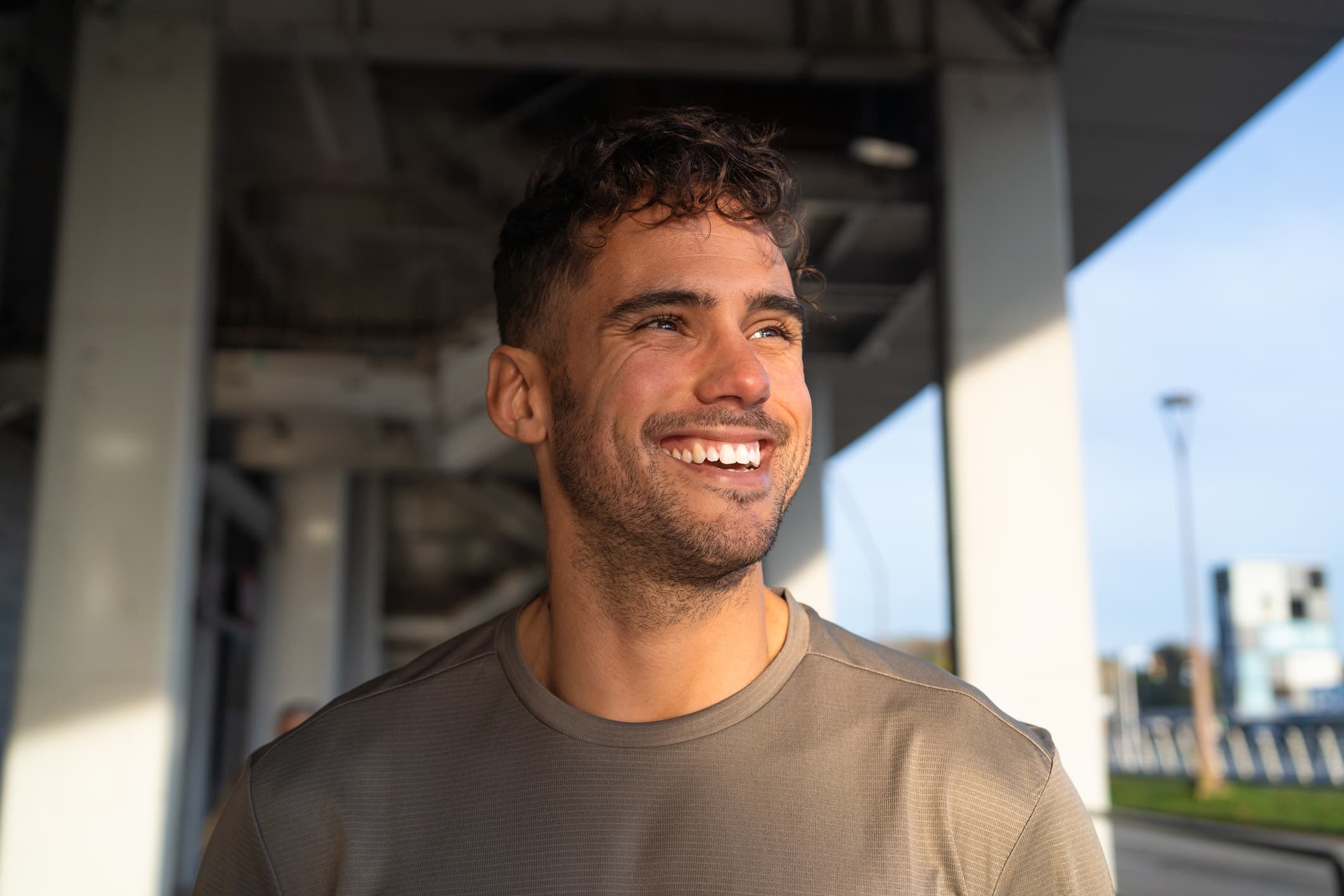 A man smiling outdoors